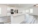 Bright and open kitchen featuring granite countertops, modern appliances, and ample lighting at 280 Limestone Circle, Conyers, GA 30013