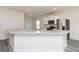 Open kitchen with granite counters, stainless steel appliances and white cabinets at 280 Limestone Circle, Conyers, GA 30013