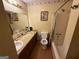 Bathroom featuring a vanity, toilet, and bathtub with shower at 6884 Red Maple Ct, Rex, GA 30273