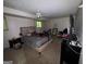 Bedroom with carpet, ceiling fan, and a window allowing for natural light at 6884 Red Maple Ct, Rex, GA 30273