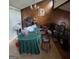 Dining room with wood paneled walls, wood-look floors and chandelier lighting at 6884 Red Maple Ct, Rex, GA 30273