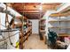 Unfinished basement with storage shelves and visible pipes offering utilitarian space at 201 Greensprings Dr, Palmetto, GA 30268