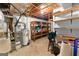 Unfinished basement providing ample storage with shelving and essential utilities visible at 201 Greensprings Dr, Palmetto, GA 30268