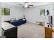 Comfortable bedroom with carpeted floors, natural light, and a ceiling fan at 201 Greensprings Dr, Palmetto, GA 30268