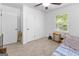 Bedroom with carpeted floor, natural light from the window, and a comfortable bed at 201 Greensprings Dr, Palmetto, GA 30268