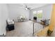 Bright living room with neutral carpet, a ceiling fan, and a staircase at 201 Greensprings Dr, Palmetto, GA 30268