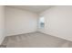 Carpeted bedroom with a window and neutral color scheme at 1500 Big Bud Ln, Locust Grove, GA 30248
