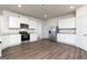 Modern kitchen featuring stainless steel appliances, sleek countertops, and ample cabinet space for storage at 1500 Big Bud Ln, Locust Grove, GA 30248