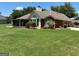 Spacious backyard featuring a screened-in porch and well-maintained lawn, perfect for outdoor enjoyment at 9361 Arbor Glenn Ct, Jonesboro, GA 30236