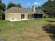 Expansive backyard with a patio and screened porch, ideal for outdoor entertaining and relaxation at 9361 Arbor Glenn Ct, Jonesboro, GA 30236