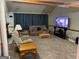 Spacious living room features comfortable seating, a large TV, and ample space for relaxation and entertainment at 9361 Arbor Glenn Ct, Jonesboro, GA 30236