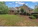 Large lawn and mature trees provides the perfect backdrop for this property at 185 Platinum Ridge Pt, Fayetteville, GA 30215