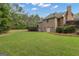 Spacious backyard with lush green lawn and mature trees at 185 Platinum Ridge Pt, Fayetteville, GA 30215