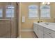 Bathroom with glass-enclosed shower, tile floor, and large vanity with double sinks at 185 Platinum Ridge Pt, Fayetteville, GA 30215