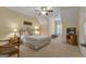 Comfortable bedroom featuring carpeted floors, a cozy bed, and soft lighting, creating a relaxing retreat at 185 Platinum Ridge Pt, Fayetteville, GA 30215
