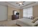 Bedroom with dresser, tv, and large windows providing plenty of natural light at 185 Platinum Ridge Pt, Fayetteville, GA 30215