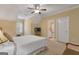 Comfortable bedroom featuring carpeted floors, a cozy bed, and soft lighting, creating a relaxing retreat at 185 Platinum Ridge Pt, Fayetteville, GA 30215