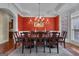 Formal dining room with classic chandelier and ample seating for dinner parties at 185 Platinum Ridge Pt, Fayetteville, GA 30215