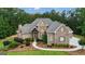 Well-maintained exterior with manicured landscaping and stone accents at 185 Platinum Ridge Pt, Fayetteville, GA 30215