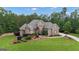 Stunning stone home featuring a lush, landscaped yard and a welcoming driveway at 185 Platinum Ridge Pt, Fayetteville, GA 30215
