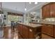 Open concept kitchen with granite island, stainless appliances, and a breakfast area at 185 Platinum Ridge Pt, Fayetteville, GA 30215