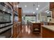 Modern kitchen with stainless steel appliances, granite countertops, and custom cabinetry at 185 Platinum Ridge Pt, Fayetteville, GA 30215