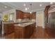 Beautiful kitchen with a large island, dual sinks and custom wood cabinetry at 185 Platinum Ridge Pt, Fayetteville, GA 30215