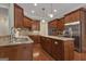 Spacious kitchen with stainless appliances, granite counters, and custom wood cabinets at 185 Platinum Ridge Pt, Fayetteville, GA 30215