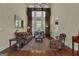 Elegant living room with high ceilings, large windows, and stylish furnishings at 185 Platinum Ridge Pt, Fayetteville, GA 30215