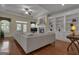 Bright living room with hardwood floors, fireplace, built-in shelving, and access to the outside at 185 Platinum Ridge Pt, Fayetteville, GA 30215