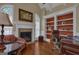 Cozy home office with fireplace, custom built-ins, and a comfortable reading chair at 185 Platinum Ridge Pt, Fayetteville, GA 30215