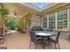 Covered patio with ceiling fan leads to open back deck and large backyard at 185 Platinum Ridge Pt, Fayetteville, GA 30215