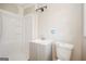 Bathroom featuring a new vanity, toilet, and shower with white walls and black light fixture at 2282 Belmont Dr, Decatur, GA 30032