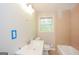 Bathroom featuring a white vanity, toilet, bathtub, and neutral tiling at 2282 Belmont Dr, Decatur, GA 30032