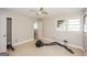 Bedroom with laminate floor, light walls, ceiling fan, and a bright double window at 2282 Belmont Dr, Decatur, GA 30032