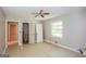 Bedroom with new flooring, large window, ceiling fan and two closets at 2282 Belmont Dr, Decatur, GA 30032