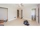 Spacious bedroom featuring light colored walls, laminate flooring, and two entryways at 2282 Belmont Dr, Decatur, GA 30032