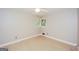 Bright bedroom featuring light walls, a ceiling fan, and a window letting in natural light at 2282 Belmont Dr, Decatur, GA 30032