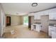Bright kitchen with modern white cabinets, granite counters, and updated appliances at 2282 Belmont Dr, Decatur, GA 30032