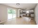 Kitchen with white cabinets, stainless steel sink and sliding glass door to backyard at 2282 Belmont Dr, Decatur, GA 30032