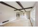 Bright living room with exposed beams and large windows for natural light at 2282 Belmont Dr, Decatur, GA 30032