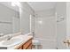 This bathroom has a tub and shower combo with a toilet and a sink vanity with a mirror at 215 Longwood Dr, Jonesboro, GA 30236