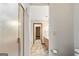 This bathroom has a shower, vanity and toilet along with a doorway into another room at 215 Longwood Dr, Jonesboro, GA 30236