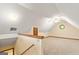 Large bonus room or attic space with sloped ceilings and neutral carpet at 215 Longwood Dr, Jonesboro, GA 30236