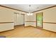 Dining room with wood flooring, chair rail detail, decorative chandelier and sunny window views at 215 Longwood Dr, Jonesboro, GA 30236