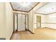 The foyer features wood flooring and trim, and lots of natural light at 215 Longwood Dr, Jonesboro, GA 30236