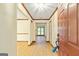 Entry way featuring wood trim, light walls, and hardwood flooring creates a warm, inviting atmosphere at 215 Longwood Dr, Jonesboro, GA 30236