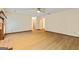 Living room with wood floors, brick fireplace, neutral walls, and plenty of open space at 215 Longwood Dr, Jonesboro, GA 30236