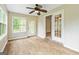 The sunroom has wood-look flooring and French doors to the outside at 215 Longwood Dr, Jonesboro, GA 30236
