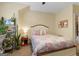 Charming bedroom featuring a floral-patterned bed, shelving, and a ceiling fan at 5130 Pratt Sw St, Covington, GA 30014